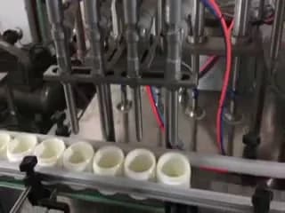 Shea butter containers on a filling line during production